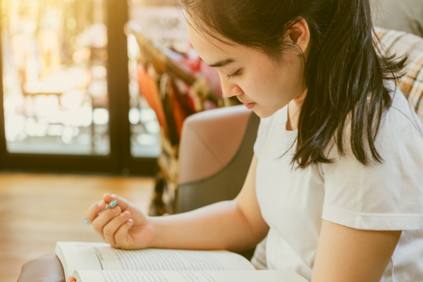 girl studying textbook