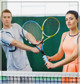 man and woman with tennis racquets