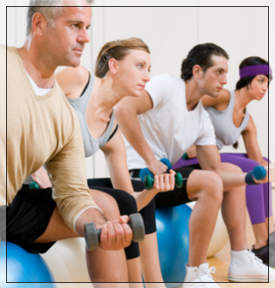 group fitness class lifting weights 