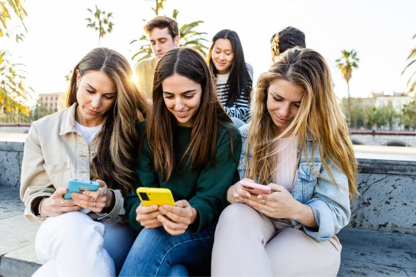 https://integrehab.com/wp-content/uploads/2023/06/group-of-young-people-looking-at-smartphones.jpg