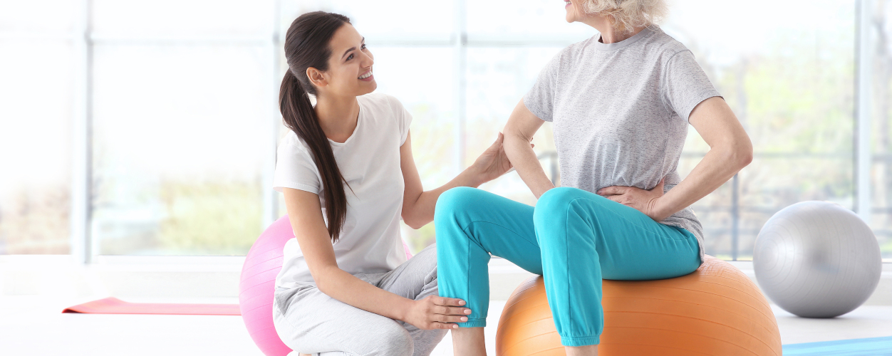 Physiotherapist working with patient