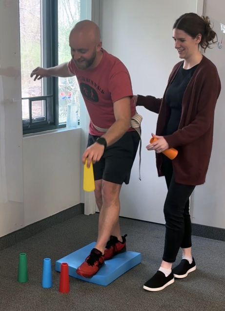 occupational therapist with patient doing exercises